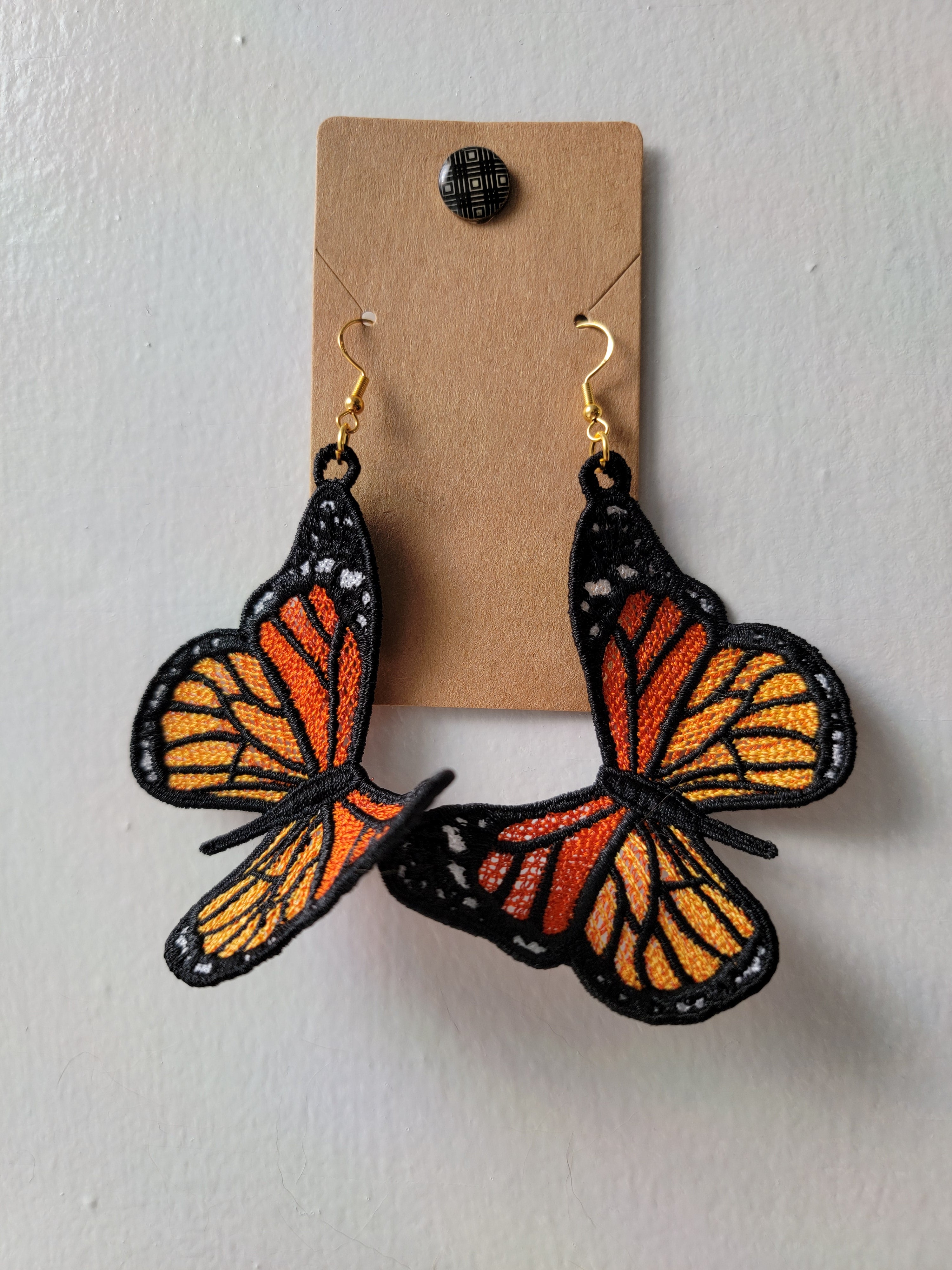 An on-ear photo of these Monarch Butterfly Earrings we made from photos of  real butterflies! : r/handmade